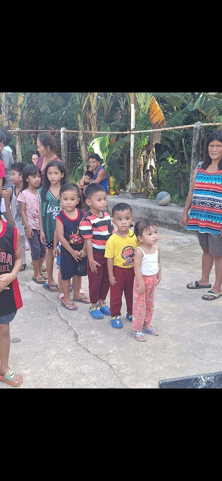 Children lined up together outdoors